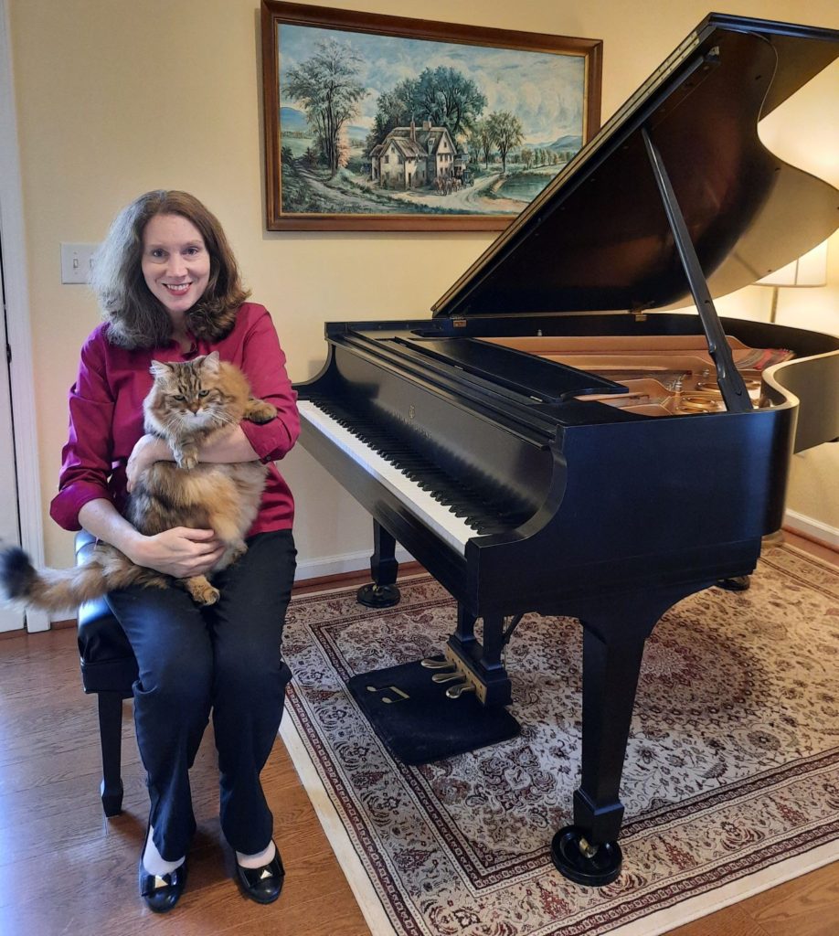 Margaret at piano with beautiful pet cat, Yuri